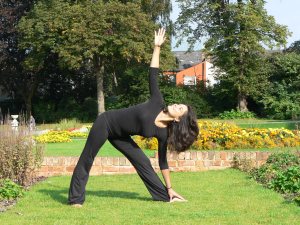 Trikonasana, also known as the Triangle Pose is useful for strengthening the legs and spine.